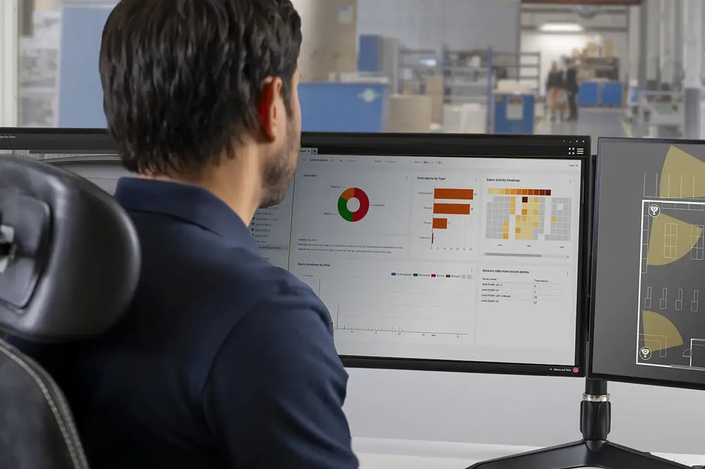 AXIS Image Health Analytics_man_watching_dashboard (1) (1) copy